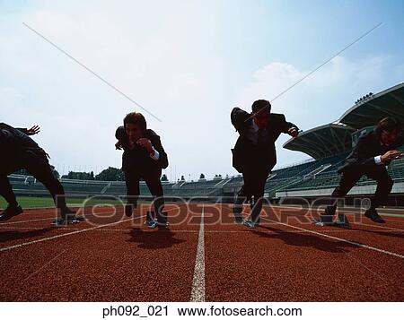 Businessmen leaving starting block View Large Photo Image Stock Image - Businessmen leaving starting block . Fotosearch