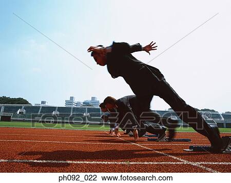 Businessmen leaving starting block View Large Photo Image Stock Image - Businessmen leaving starting block . Fotosearch