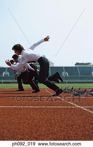 Stock Photo - Businessmen leaving starting block . Fotosearch