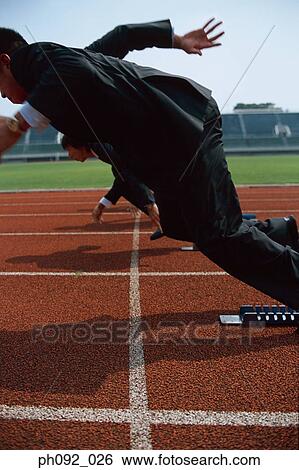 Stock Photograph - Businessmen leaving starting block . Fotosearch