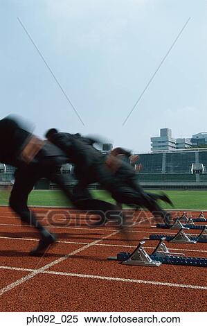 Stock Photography - Businessmen leaving starting block . Fotosearch