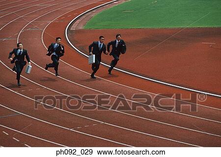 Businessmen sprinting, carrying briefcases View Large Photo Image Stock Photo - Businessmen sprinting, carrying briefcases. Fotosearch