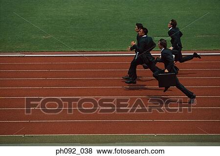 Businesspeople running on stadium track, carrying briefcases View Large Photo Image Stock Photo - Businesspeople running on stadium track, carrying briefcases. Fotosearch