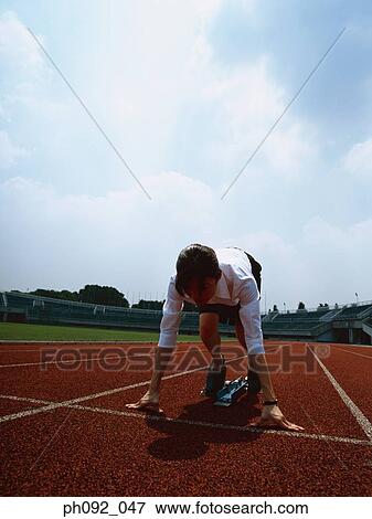 Businesswoman at starting block View Large Photo Image Stock Photo - Businesswoman at starting block . Fotosearch