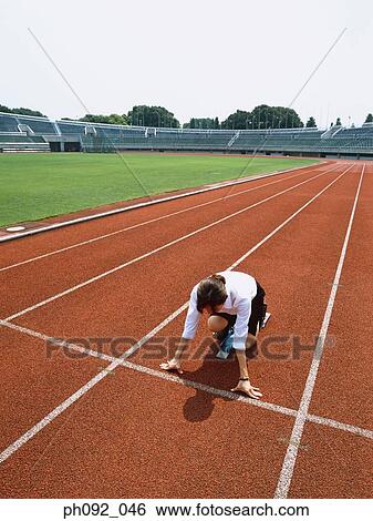 Stock Photograph - Businesswoman at starting block . Fotosearch