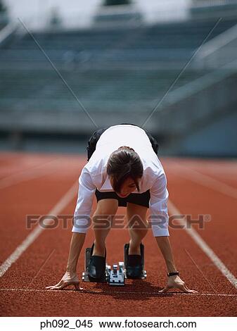 Businesswoman at starting block View Large Photo Image Stock Photography - Businesswoman at starting block . Fotosearch