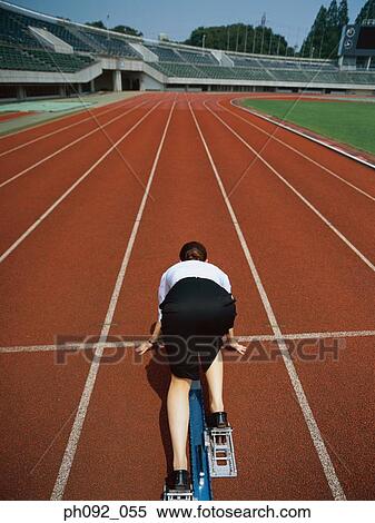 Stock Photography - Businesswoman at starting block . Fotosearch