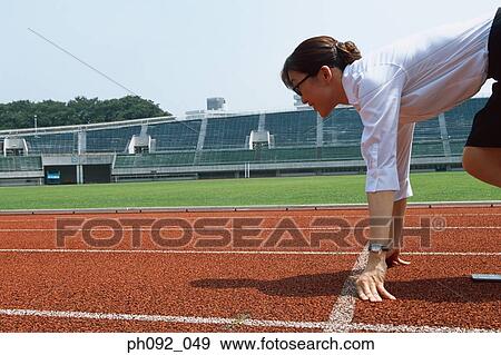Businesswoman at starting line View Large Photo Image Stock Photo - Businesswoman at starting line . Fotosearch