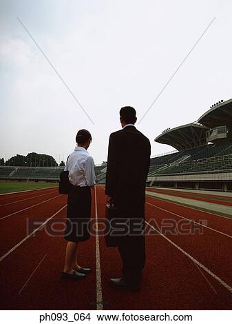 Picture - Business people standing on track. Fotosearch
