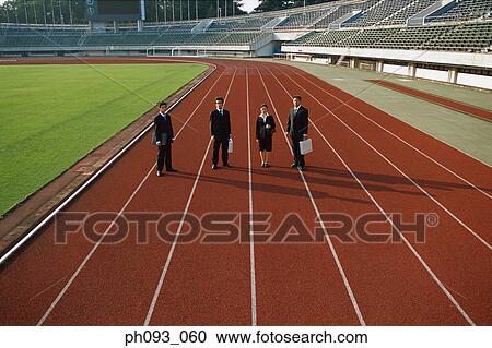 Business people standing on track View Large Photo Image Stock Image - Business people standing on track. Fotosearch