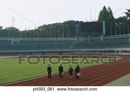Business people standing on track View Large Photo Image Stock Image - Business people standing on track. Fotosearch