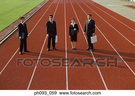Stock Photo - Business people standing on track. Fotosearch