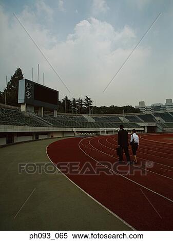 Business people walking on track View Large Photo Image Stock Photography - Business people walking on track. Fotosearch