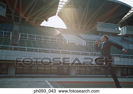 Stock Image - Businessman long-jumper. Fotosearch