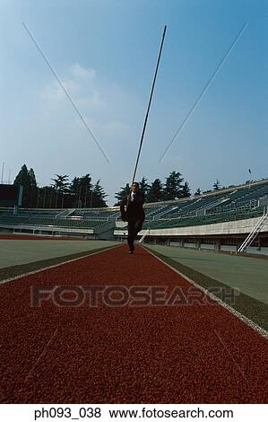 Businessman pole vaulter View Large Photo Image Stock Photo - Businessman pole vaulter. Fotosearch