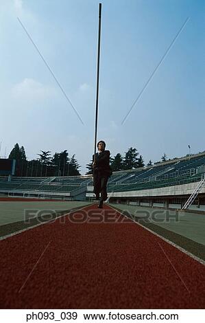 Businessman pole vaulter View Large Photo Image Stock Photo - Businessman pole vaulter. Fotosearch