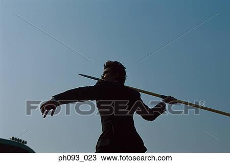 Businessman throwing a javelin View Large Photo Image Stock Image - Businessman throwing a javelin. Fotosearch