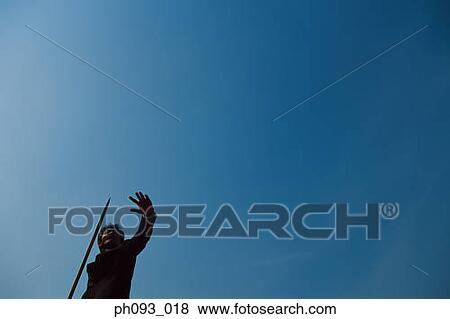 Stock Photo - Businessman throwing a javelin. Fotosearch