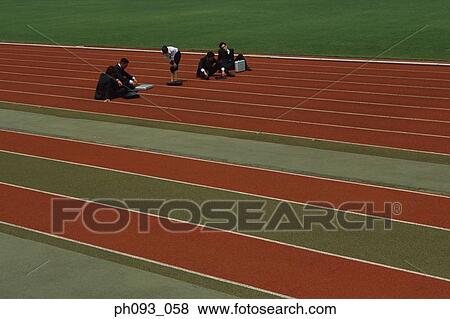 Stock Photo - Exhausted business people on track. Fotosearch