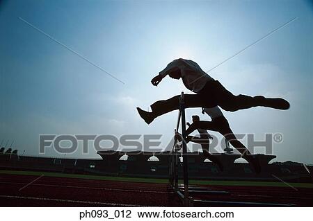 Silhouette of businessman leaping hurdle View Large Photo Image Stock Image - Silhouette of businessman leaping hurdle. Fotosearch