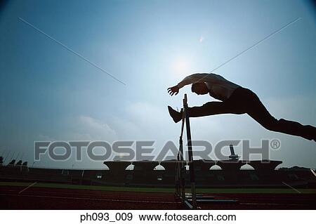 Silhouette of businessman leaping hurdle View Large Photo Image Stock Photo - Silhouette of businessman leaping hurdle. Fotosearch