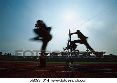 Silhouette of businessmen leaping hurdle View Large Photo Image Picture - Silhouette of businessmen leaping hurdle. Fotosearch