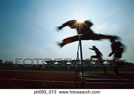 Silhouette of businessmen leaping hurdle View Large Photo Image Stock Image - Silhouette of businessmen leaping hurdle. Fotosearch