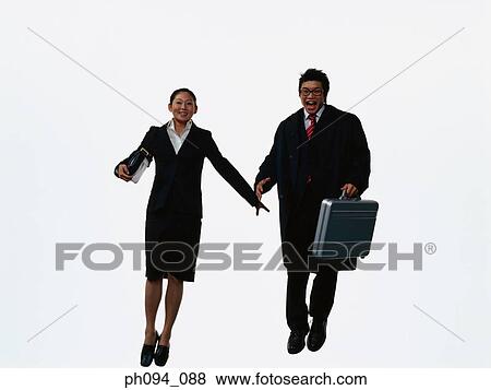 Young business people leaping in air, holding hands View Large Photo Image Stock Photo - Young business people leaping in air, holding hands. Fotosearch