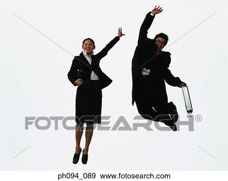 Young business people leaping in air, holding a briefcase View Large Photo Image Stock Photo - Young business people leaping in air, holding a briefcase . Fotosearch