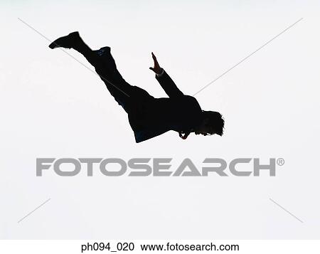 Young businessman leaping in air View Large Photo Image Stock Image - Young businessman leaping in air. Fotosearch