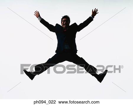 Young businessman leaping in air View Large Photo Image Stock Image - Young businessman leaping in air. Fotosearch