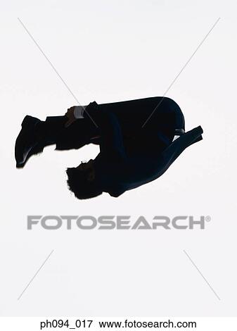Young businessman leaping in air View Large Photo Image Stock Photo - Young businessman leaping in air. Fotosearch