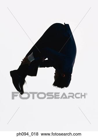 Young businessman leaping in air View Large Photo Image Stock Photo - Young businessman leaping in air. Fotosearch