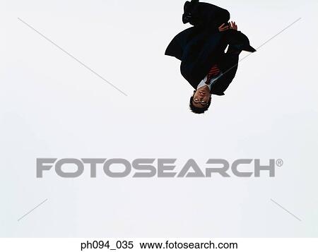 Young businessman leaping in air View Large Photo Image Stock Photography - Young businessman leaping in air. Fotosearch