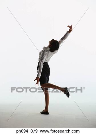 Young businesswoman in dancing posture View Large Photo Image Stock Photo - Young businesswoman in dancing posture. Fotosearch