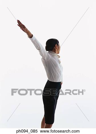 Stock Photography - Young businesswoman in dancing posture. Fotosearch