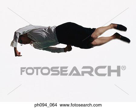 Young businesswoman leaping in air, holding a handbag View Large Photo Image Picture - Young businesswoman leaping in air, holding a handbag . Fotosearch