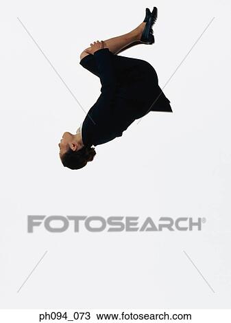 Young businesswoman leaping in air View Large Photo Image Stock Image - Young businesswoman leaping in air. Fotosearch