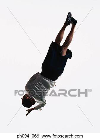 Young businesswoman leaping in air, holding a handbag View Large Photo Image Stock Photography - Young businesswoman leaping in air, holding a handbag . Fotosearch