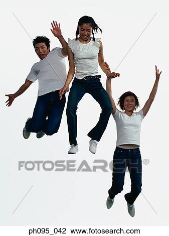 Group of friends in jeans and t-shirts, jumping in mid-air View Large Photo Image Stock Image - Group of friends in jeans and t-shirts, jumping in mid-air. Fotosearch