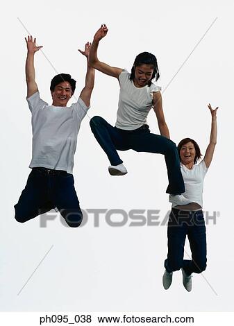 Group of friends in jeans and t-shirts, jumping in mid-air View Large Photo Image Stock Photo - Group of friends in jeans and t-shirts, jumping in mid-air. Fotosearch