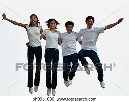 Group of friends in jeans and t-shirts, jumping in mid-air View Large Photo Image Stock Photograph - Group of friends in jeans and t-shirts, jumping in mid-air. Fotosearch