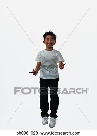 Young Asian boy in jeans & t-shirt, jumping in mid-air View Large Photo Image Stock Photo - Young Asian boy in jeans & t-shirt, jumping in mid-air. Fotosearch
