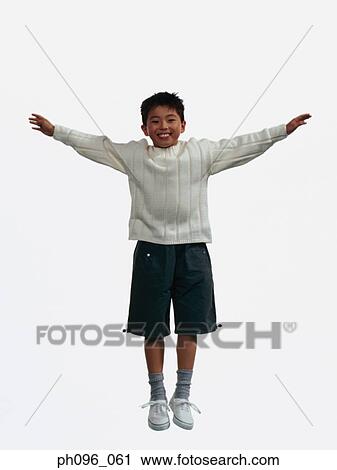 Young Asian boy in shorts & sweat-shirt, jumping in mid-air View Large Photo Image Stock Image - Young Asian boy in shorts & sweat-shirt, jumping in mid-air. Fotosearch