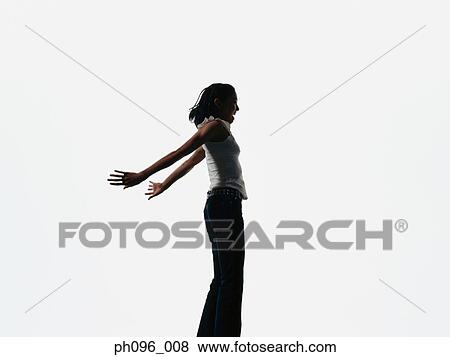 Young Asian girl in jeans & t-shirt, jumping in mid-air View Large Photo Image Stock Photo - Young Asian girl in jeans & t-shirt, jumping in mid-air. Fotosearch