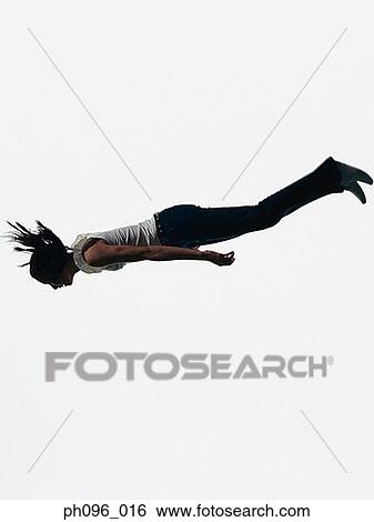 Young Asian girl in jeans & t-shirt, jumping in mid-air View Large Photo Image Stock Photograph - Young Asian girl in jeans & t-shirt, jumping in mid-air. Fotosearch