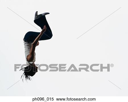 Young Asian girl in jeans & t-shirt, jumping in mid-air View Large Photo Image Stock Photography - Young Asian girl in jeans & t-shirt, jumping in mid-air. Fotosearch