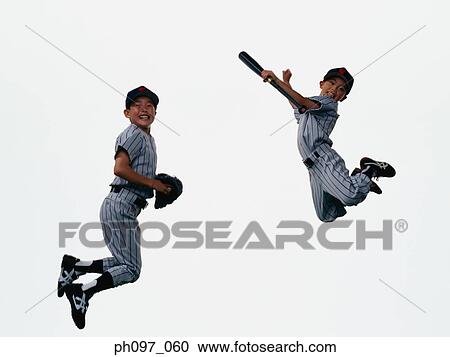 Two young baseball players jumping in mid-air View Large Photo Image Stock Image - Two young baseball players jumping in mid-air. Fotosearch