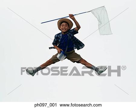 Young Asian boy with butterfly net, jumping in mid-air View Large Photo Image Stock Image - Young Asian boy with butterfly net, jumping in mid-air. Fotosearch