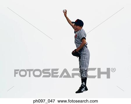 Stock Photo - Young Baseball player catching ball in glove in mid-air. Fotosearch